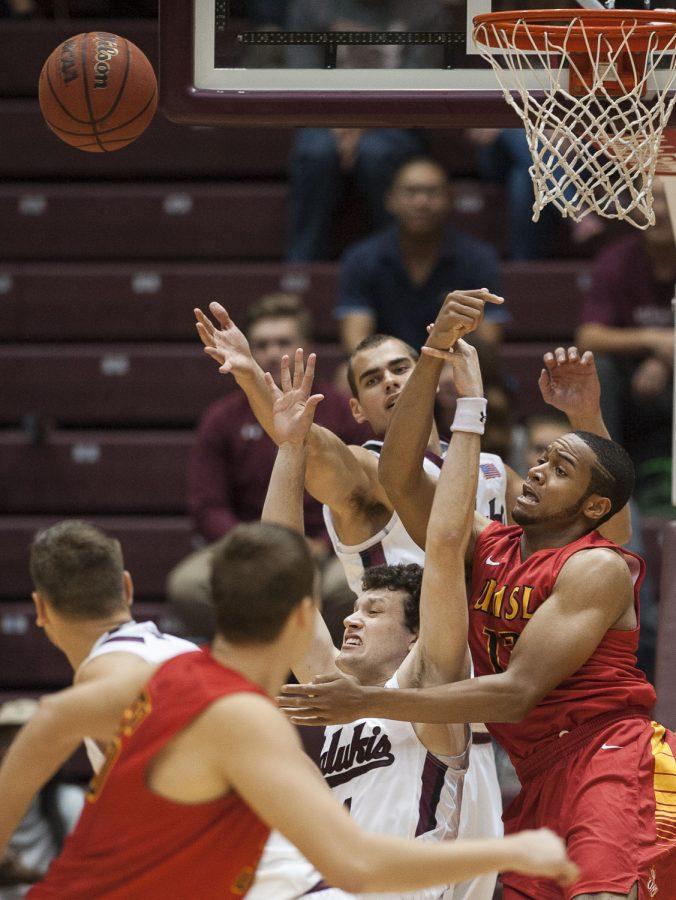 Players scramble to rebound a missed shot Thursday, Nov. 3, 2016, during the Salukis 72-67 exhibition win over the UMSL Tritons at SIU Arena. (Ryan Michalesko | @photosbylesko)