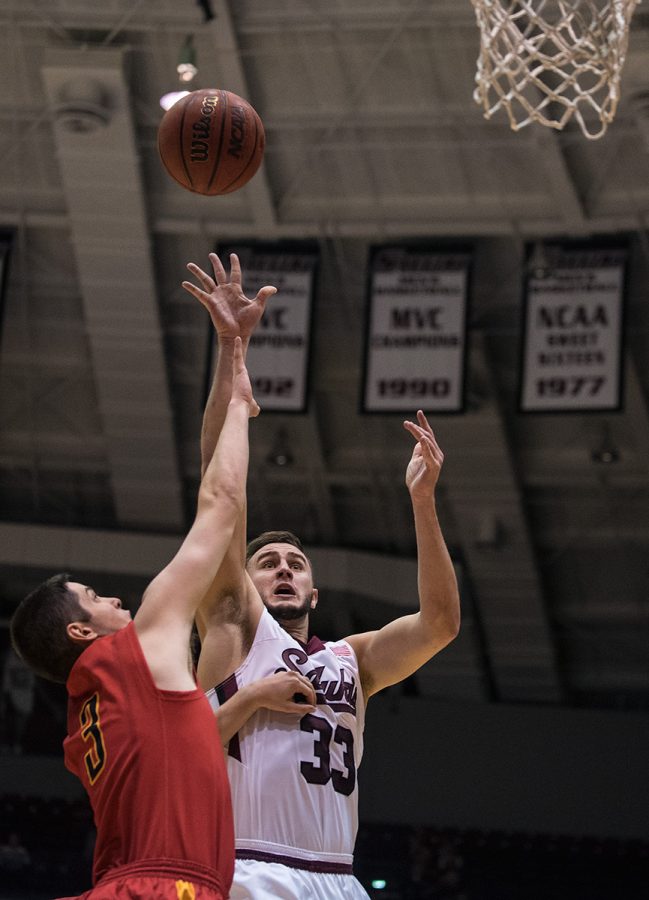 Saluki senior forward Sean OBrien attempts a basket while being guarded by UMSL junior guard Max Cook during SIUs 72-67 exhibition victory against UMSL on Thursday, Nov. 3, 2016, at SIU Arena. OBrien had a total of 10 points in the game. (Jacob Wiegand | @JacobWiegand_DE)