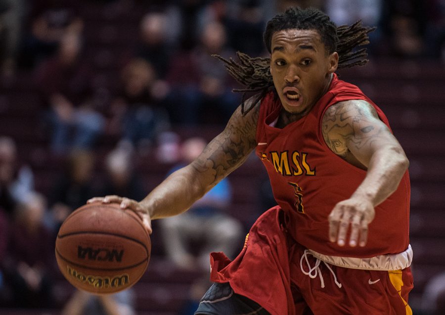 UMSL senior guard Joseph English takes the ball toward the basket during SIUs 72-67 exhibition win Thursday, Nov. 3, 2016, at SIU Arena. English score 13 points in the game. (Jacob Wiegand | @JacobWiegand_DE)