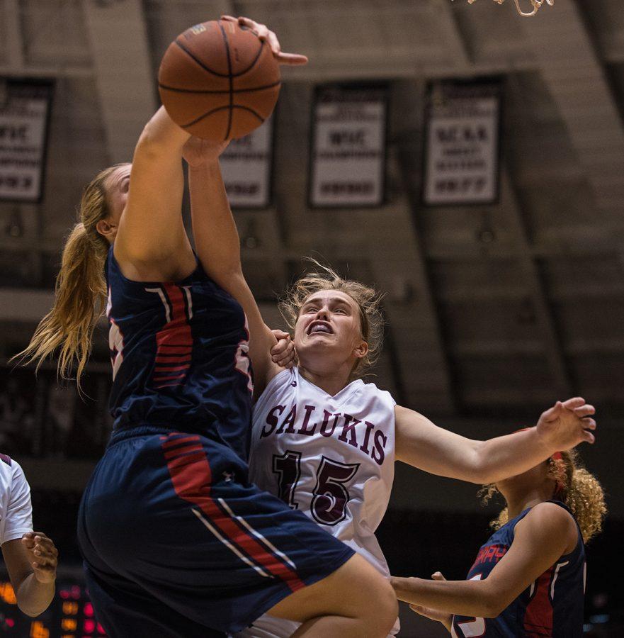 Saluki freshman guard/forward Caitlyn Claussen and Highlander freshman post Danielle Popis go for a rebound during SIUs 114-24 exhibition win against McMurray College on Friday, Nov. 4, 2016, at SIU Arena. (Jacob Wiegand | @JacobWiegand_DE)