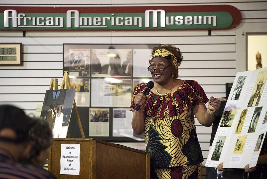 Elder Marilyn James, of Carbondale, indicates to a 1937 image of her great-great-grandfather, the Rev. D. Smith Banks, during her From Slavery to Greatness speech Saturday, Nov. 5, 2016, at the African American Museum in the University Mall. (Morgan Timms | @Morgan_Timms)