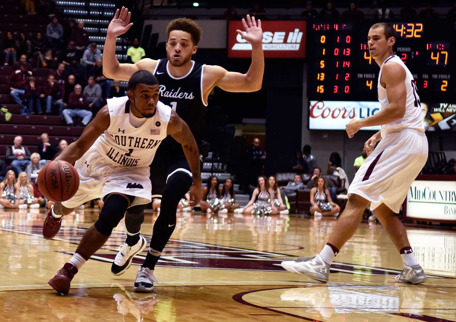 SIU senior guard Mike Rodriguez dribbles around Wright State junior guard Justin Mitchell during the Salukis' 85-81 loss to Wright State on Friday, Nov. 11, 2016, at SIU Arena. (Sean Carley | @SCarleyDE)