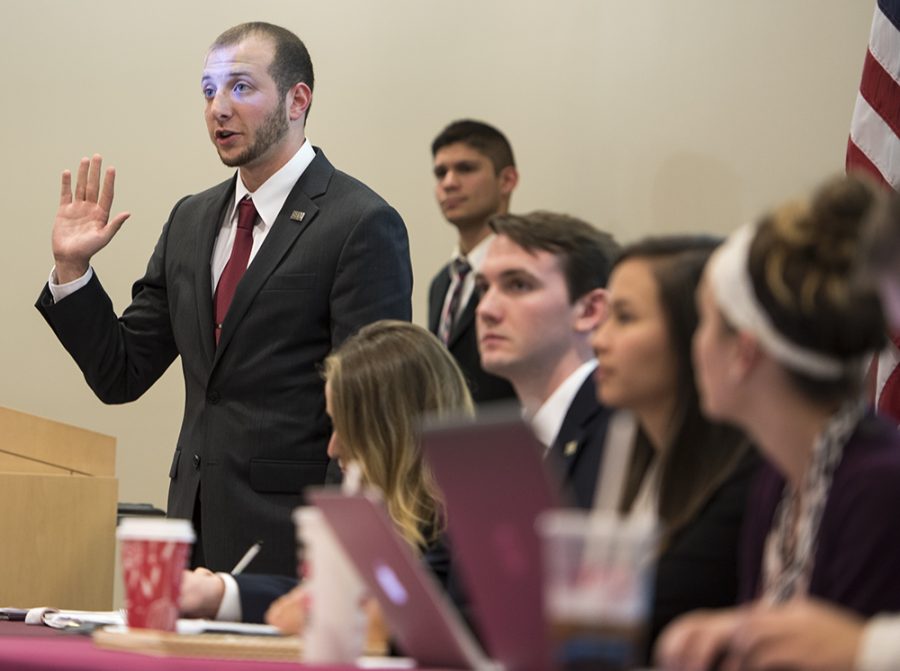 Undergraduate Student Government President Jared Stern swears in a new senator Tuesday, Nov. 15, 2016, during a meeting in the Student Health Center Auditorium. (Bill Lukitsch | @lukitsbill)
