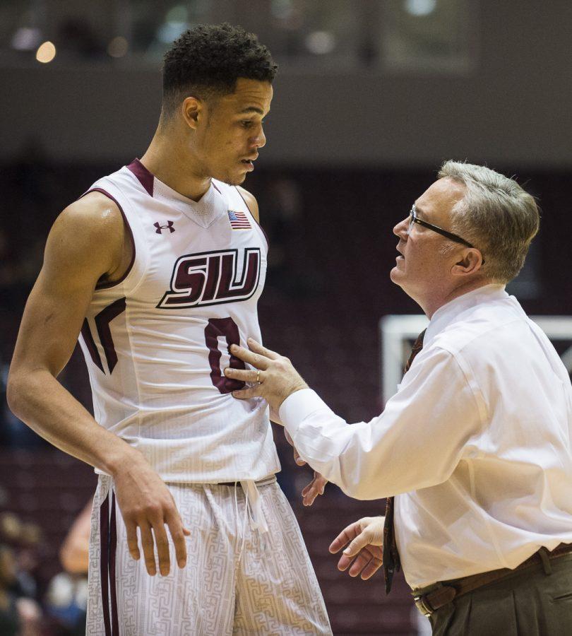 Coach Barry Hinson speaks to junior guard Jonathan Wiley (0) during a timeout Wednesday, Nov. 16, 2016, during the Salukis 85-64 win over the Missouri Southern Lions at SIU Arena. (Ryan Michalesko | @photosbylesko)