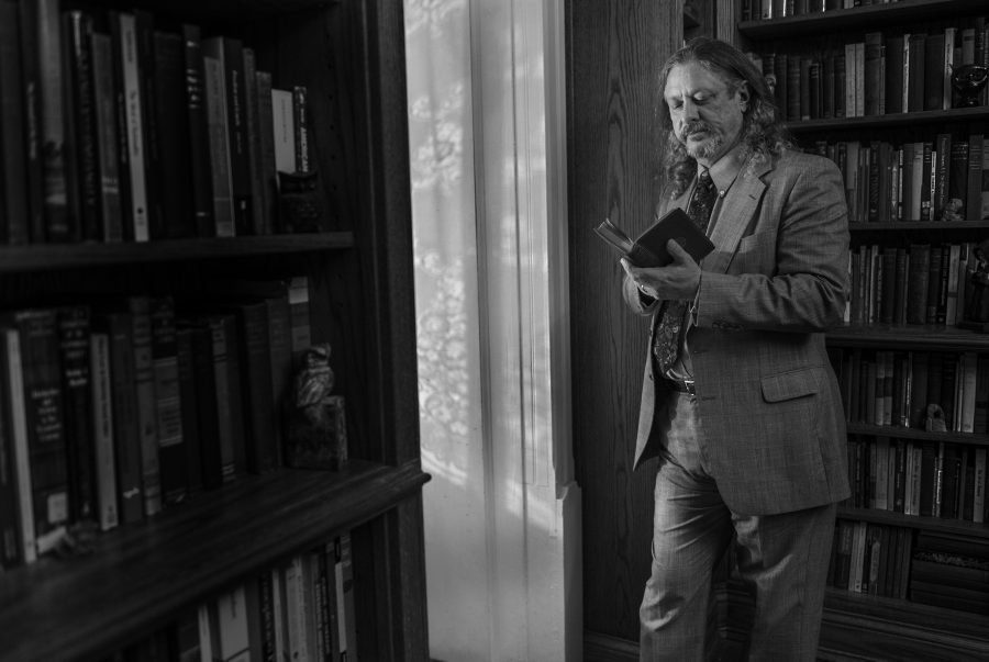 Professor of philosophy Randall Auxier poses for a portrait Monday, Nov. 21, 2016, in his Murphysboro home prior to its opening ceremony as the American Institute for Philosophical and Cultural Thought. The institute, which houses an estimated 35,000 books and scholarly articles, was established as a research site for humanities students in response to the closure of SIUs Center for Dewey Studies. It didnt look anything like this when we moved in, Auxier said. Its taken a lot of work. (Ryan Michalesko | @photosbylesko)