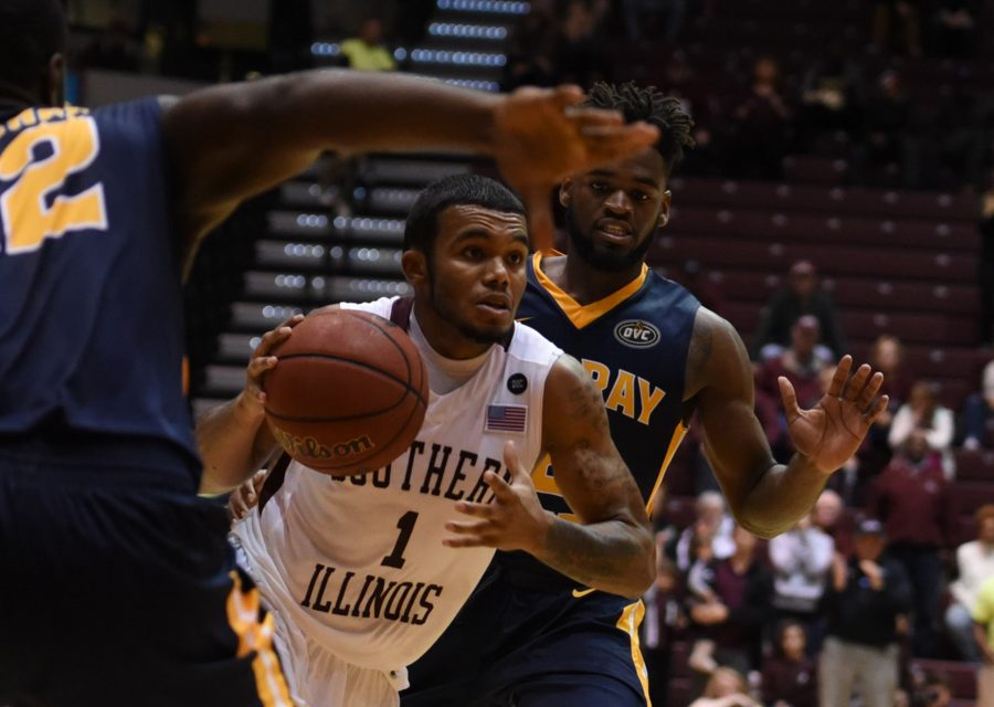 Senior guard Mike Rodriguez drives toward the basket as he is guarded by senior guard Gee McGhee, left, and junior guard Jonathan Stark on Tuesday, Nov. 29, 2016, during SIU's 89-85 overtime win against Murray State at SIU Arena. (Bill Lukitsch | @lukitsbill)