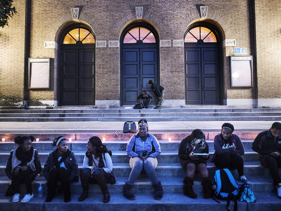 Asia Lee, a masters student in business administration from Chicago, speaks to Lamont Blackman, a senior from Chicago studying aviation, while students gather on the steps of Shryock Auditorium on Wednesday, Nov. 9, 2016, before a group reflection with Rev. Joseph Brown in response to Donald Trumps presidency. The reflection began with a performance of Amazing Grace and ended with speeches from Brown and Lee. Are we not feeling today like weve been thrown back in the bottom of a ship on our way to somewhere dangerous and death-inducing? said Brown, a professor of Africana Studies. So somebody suggested, even in the darkest hour, lets get together with just a little bit of light and find a way to tell each other you may have been blind, but oh, now you see. (Morgan Timms | @Morgan_Timms)