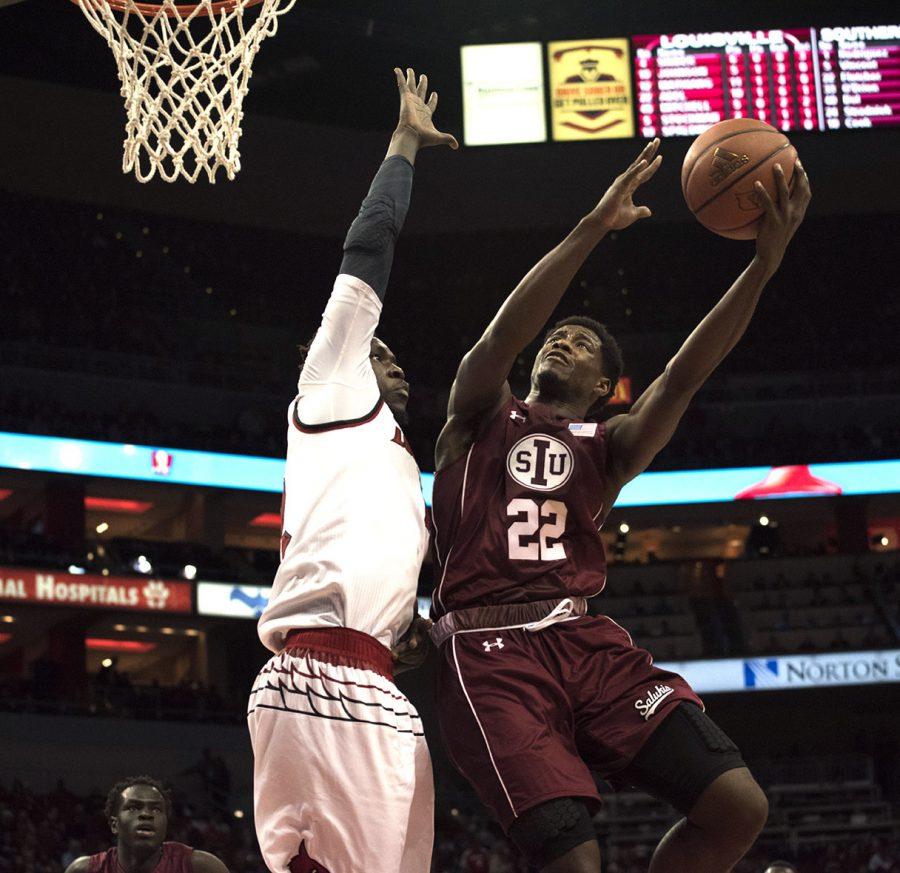 Sophomore guard Armon Fletcher attempts a layup Wednesday, Dec. 7, 2016, during the Salukis 74-51 loss to the Cardinals at the KFC Yum! Center in Louisville, Ky. (Athena Chrysanthou | @Chrysant1Athena) 