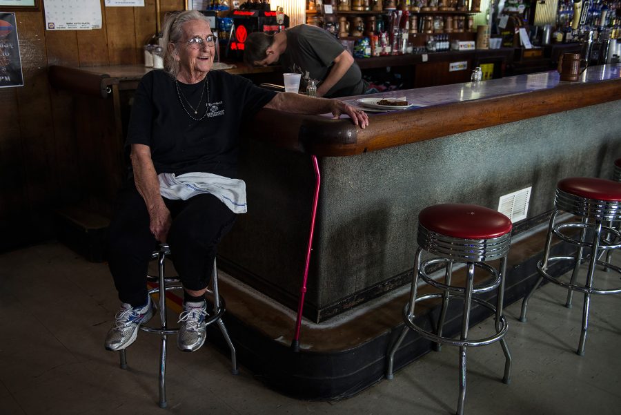 Gwen Hunt, owner of Pizza King, cracks a smile Wednesday, Dec. 7, 2016, at the local bar in Carbondale. Hunt has owned the bar, more commonly known as PKs, for 61 years. (Jacob Wiegand | @jawiegandphoto)