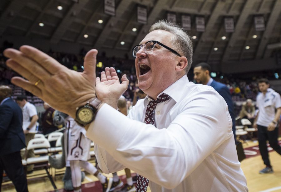 Coach Barry Hinson celebrates following the Salukis 80-74 overtime win against the Indiana State Sycamores on Wednesday, Jan. 4, 2017, at SIU Arena. (Ryan Michalesko | @photosbylesko)