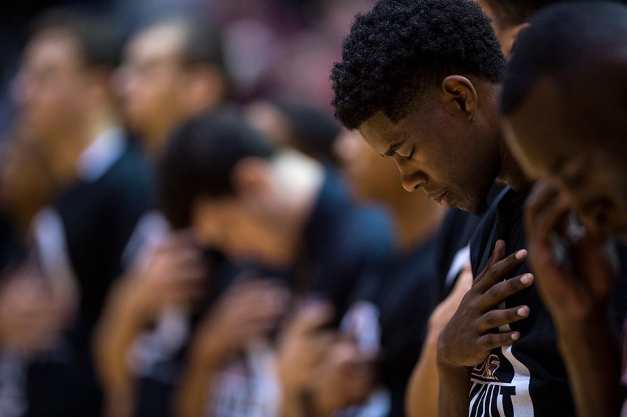Saluki sophomore guard Armon Fletcher bows his head during the singing of the national anthem prior to the start of SIUs 60-53 loss to the Illinois State Redbirds on Wednesday, Jan. 11, 2017, at SIU Arena. Fletcher scored 12 points in the game. (Jacob Wiegand | @jawiegandphoto)