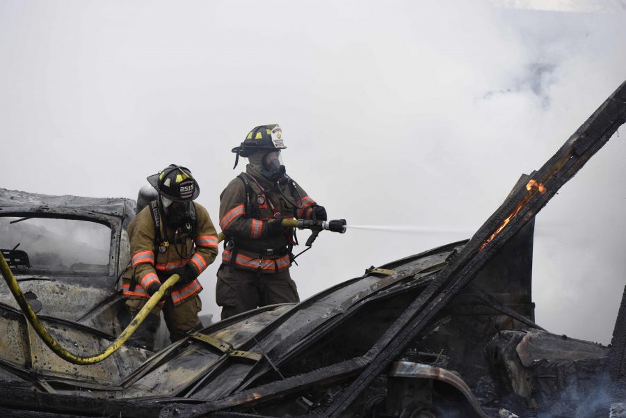 Firefighters extinguish remaining flames of a destroyed garage Wednesday, Feb. 1, 2017, after a fire near the intersection of Kennedy and Union Hill roads. (Bill Lukitsch | @lukitsbill)