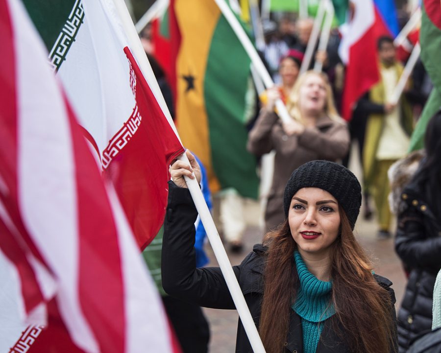 Azadeh Amiri, a graduate student in mechanical engineering from Tehran, Iran, marches with her countrys flag Monday, Feb. 6, 2017, during the International Parade of Flags from Woody Hall to the Student Center. It doesnt matter where youre from, Amiri said. You just see friendship and unity between our international students. I think its a beautiful thing.(Morgan Timms | @Morgan_Timms)