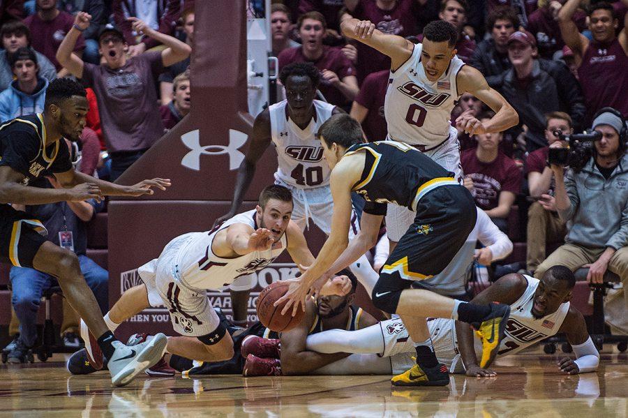Salukis and Shockers scramble for the ball during SIUs 87-68 loss to Wichita State on Wednesday, Feb. 15, 2017, at SIU Arena. (Jacob Wiegand | @jawiegandphoto)