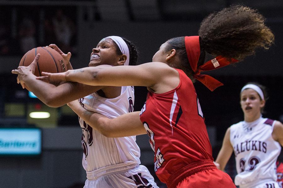 Saluki freshman guard Kristen Nelson attempts to keep the ball away from Redbird sophomore guard Katrina Beck during SIU’s 57-48 victory against Illinois State on Friday, Feb. 24, 2017, at SIU Arena. Nelson scored five points in the game. (Jacob Wiegand | @jawiegandphoto) 
