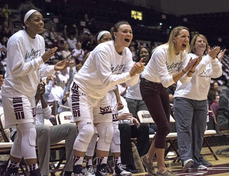 Members of the Saluki women’s basketball team celebrate after a basket Sunday, Feb. 5, 2017, during SIU’s 64-59 win against Northern Iowa at SIU Arena. (Athena Chrysanthou | @Chrysant1Athena)