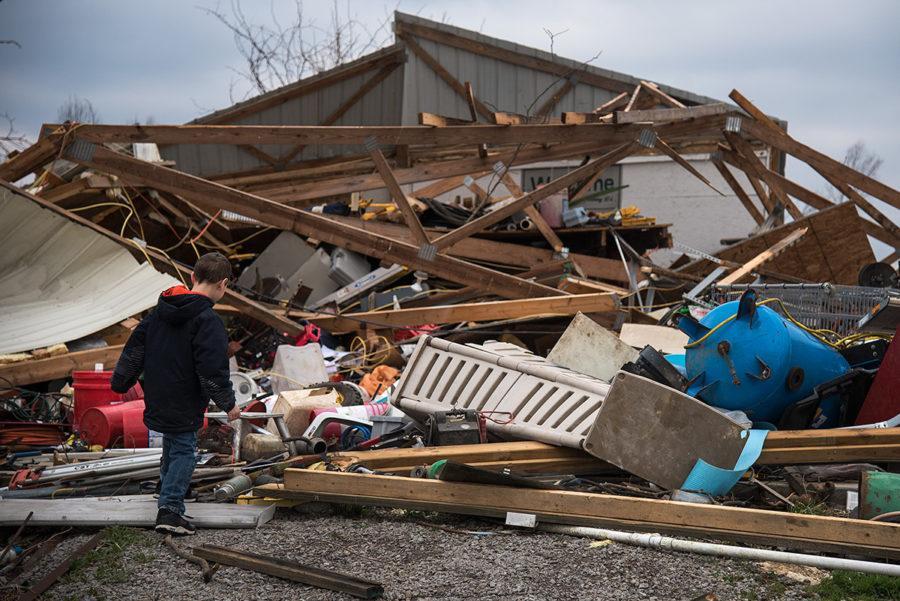 Seven-year-old Mayson Robinson, of Willisville, traverses the wreckage of his aunt Kassi Coulson’s barn Wednesday, March 1, 2017, in Ava. Tuesday night a tornado damaged the roof of Coulson’s home, from which daylight can now be seen from inside the house, destroyed the family’s barn, knocked down trees and damaged vehicles. “You just don’t think it’s going to hit you like that,” Coulson said. “All in like a blink of an eye just the wind was in here, my five-year-old’s crying and screaming. … When I was shutting that door I could literally feel the air in here. I thought that window was open, I didn’t realize it was the roof.” (Jacob Wiegand | @jawiegandphoto)