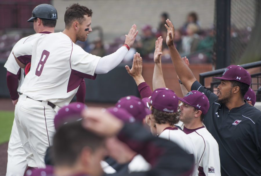 Senior+outfielder+Jake+Hand+high-fives+teammates+in+the+bullpen+Saturday%2C+March+25%2C+2017%2C+after+scoring+a+run+against+the+Jacksonville+State+Gamecocks.+The+Salukis+beat+the+Gamecocks+5-4+during+the+second+of+a+three-game+series+at+Itchy+Jones+Stadium.+%28Bill+Lukitsch+%7C+%40lukitsbill%29