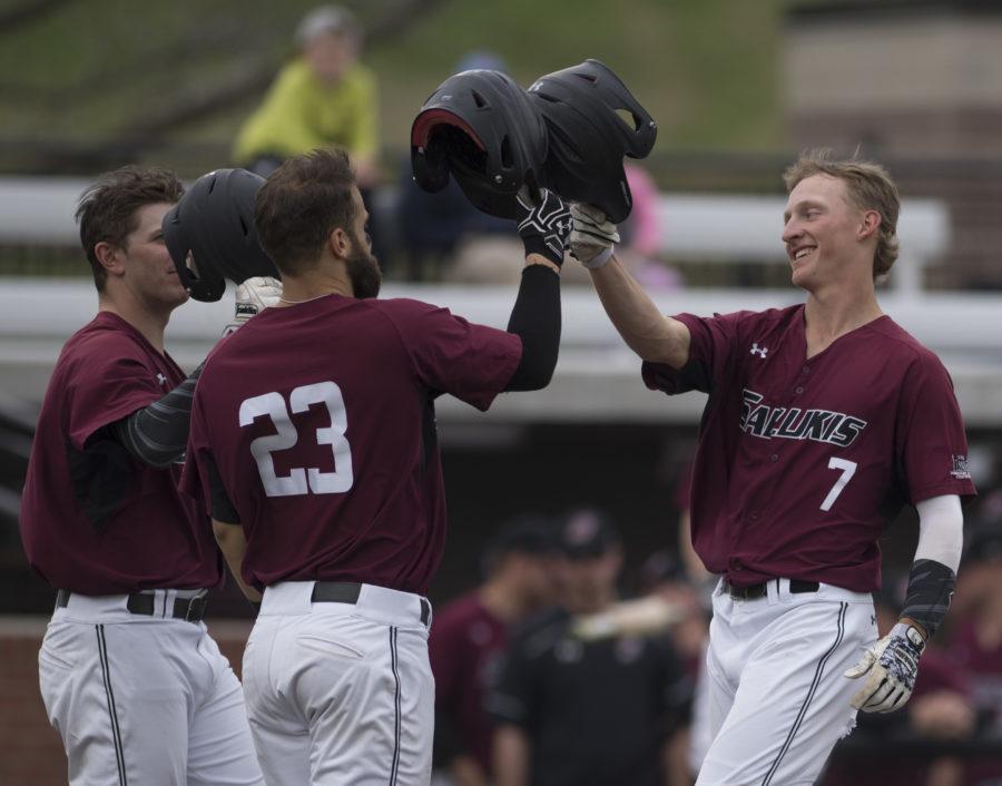 Junior infielder Connor Kopach (7) celebrates after hitting a two-run home run Friday, March 24, 2017, alongside senior infielder Ryan Sabo (23) and senior infielder Will Farmer. The Jacksonville State Gamecocks went on to beat SIU 8-6 during the first of a three-game series at Itchy Jones Stadium. (Bill Lukitsch | @lukitsbill)