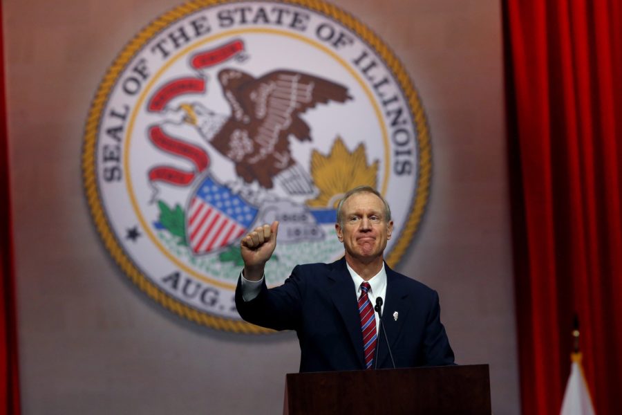 Gov. Bruce Rauner gives a thumbs up after giving his first speech as governor on Monday Jan. 12, 2015 at the Prairie Capital Convention Center in Springfield, Ill. (Nancy Stone | Chicago Tribune)