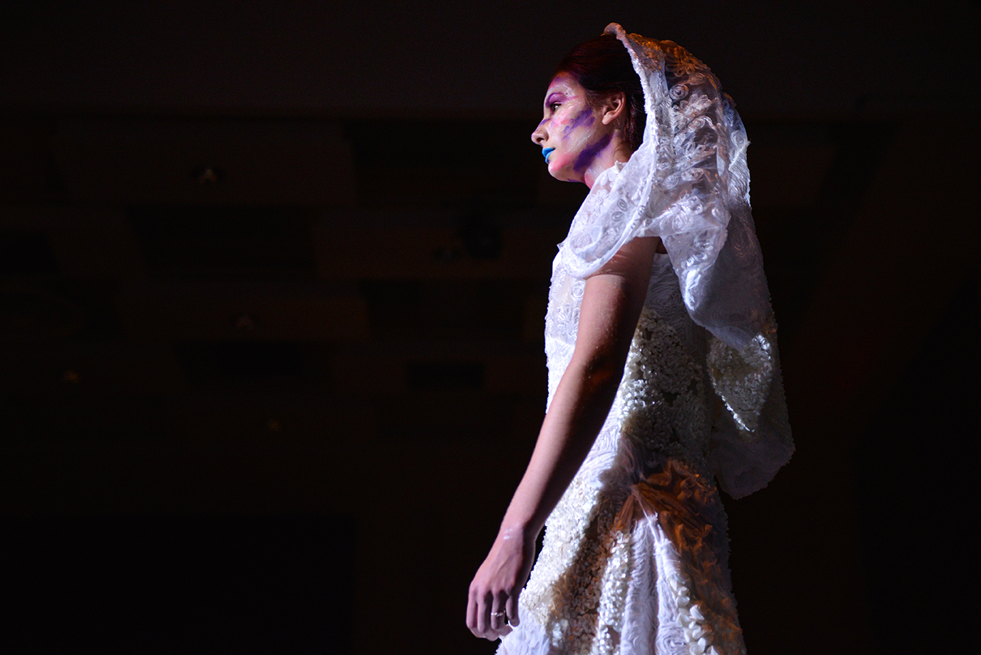 Emily Bouchoc, a junior studying cinema from Collierville, Tennessee, models on the runway during the fashion design and merchandising student showcase and fashion show Thursday, April 27, 2017, in the Student Center ballrooms. The dress was designed by Olivia Martinez, a junior in the fashion design and merchandising program from Round Lake, who designed six pieces in the showcase. (Branda Mitchell | @branda_mitchell)