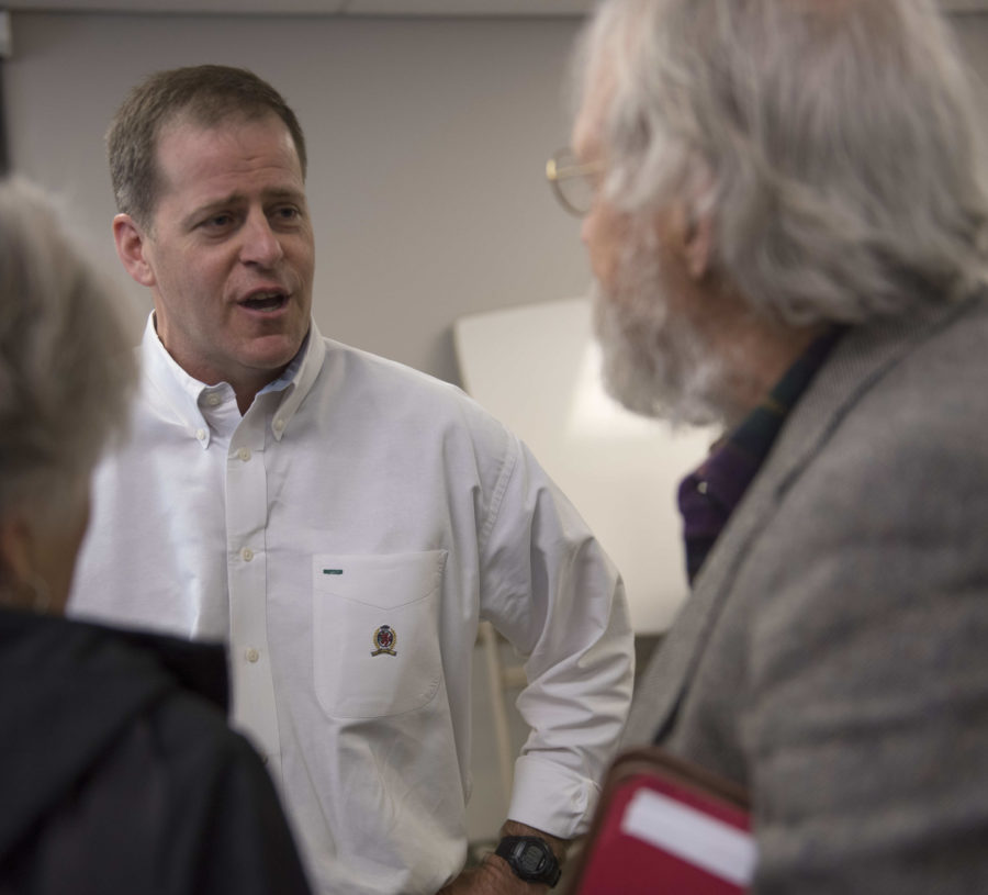Illinois Sen. Paul Schimpf, R-Waterloo, speaks with district resident and retired SIU professor Steven Kraft on Saturday, April 1, 2017, after a town hall meeting at Carbondale Township Hall. (Bill Lukitsch | @lukitsbill) 