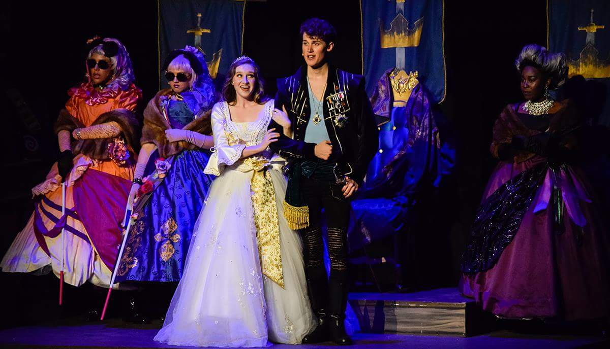 Cinderella, portrayed by Shelby Terrell, of Nashville, Tennessee, and her Prince, played by Jonathan Steffins, of Bixby, Oklahoma, are presented before her blinded stepsisters, left, – Lucinda, played by Asia Ward and Florinda, played by Emily Turner, both sophomores in the musical theater program, and step mother, right, senior Alexis Nwokoji, of Nashville, Tennessee, during a Summer Playhouse 2017 musical series performance of “Into The Woods,” Saturday, June 17, 2017, in McLeod Theater.  (William Cooley | @Wcooley1980)