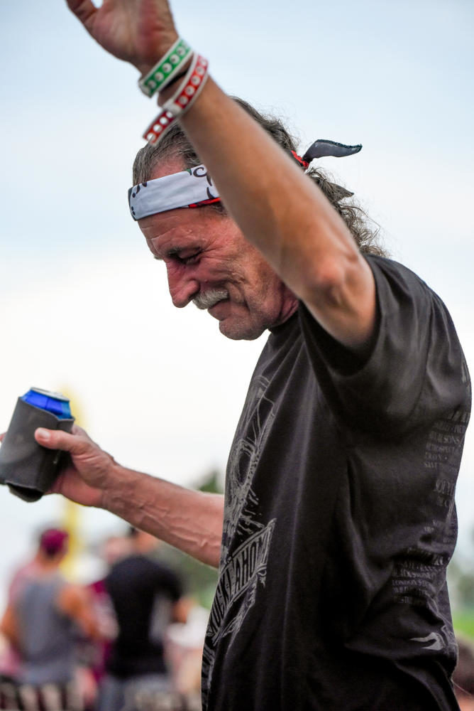 Condor, a Springfield, Missouri native and stage performer, dances in the crowd during a set change Friday, Aug. 18, 2017, at Moonstock music festival at Walker’s Bluff Winery in Carterville. This is the sixth festival Condor has enjoyed with his wife and hopes to keep the tradition going. (William Cooley| @Wcooley1980)