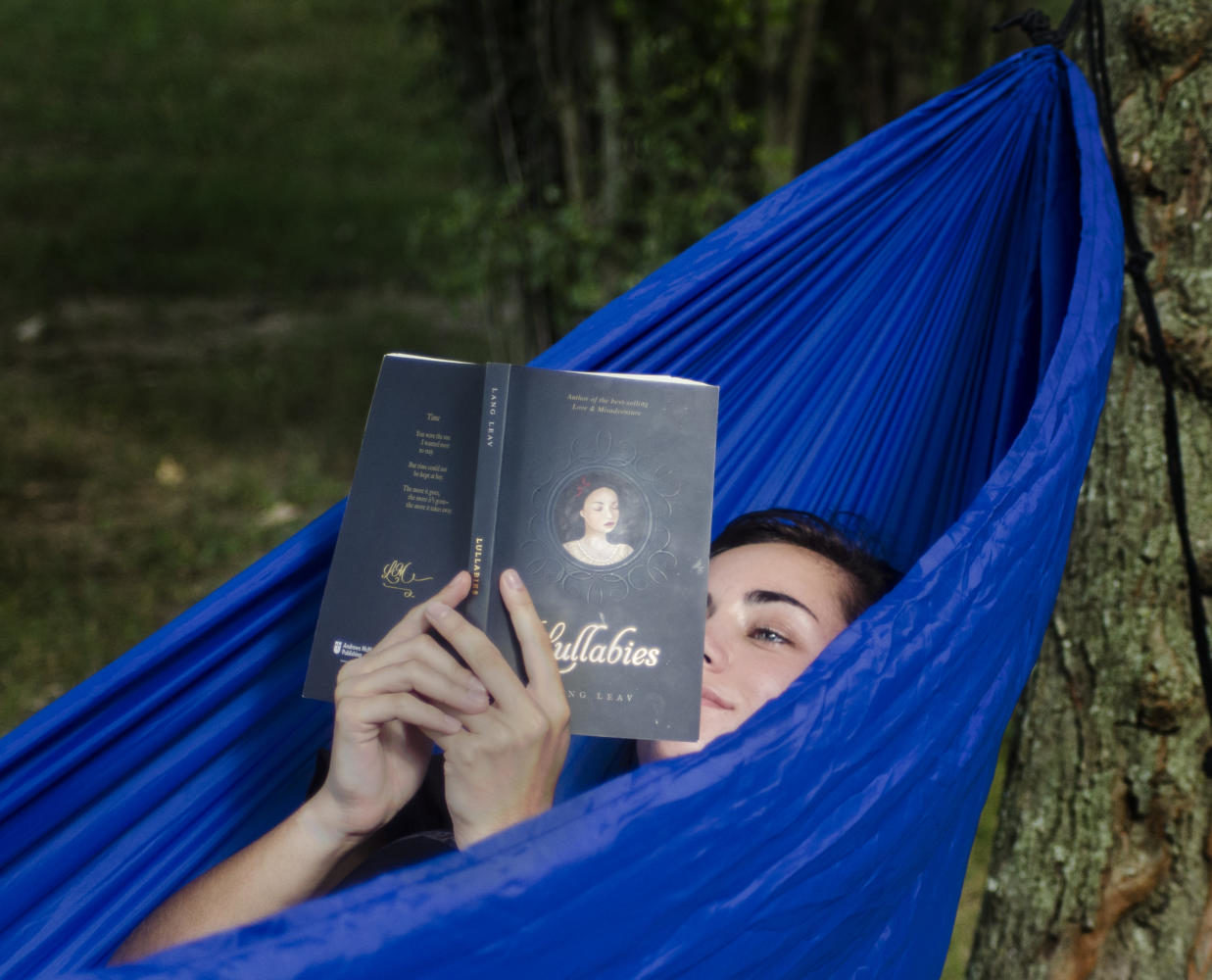 Taylor Goldtrap, a junior from Kankakee majoring in forestry, read a poetry book while relaxing in a hammock Tuesday, Aug. 22, 2017, at Thompson Point. I chose this spot because it was near my dorm building and the trees were positioned perfectly to connect my [hammock] attachments, Goldtrap said. I was reading the book Lullabies by Lang Leave because I was looking for inspiration to write again. (Dylan Nelson | @Dylannelson99)