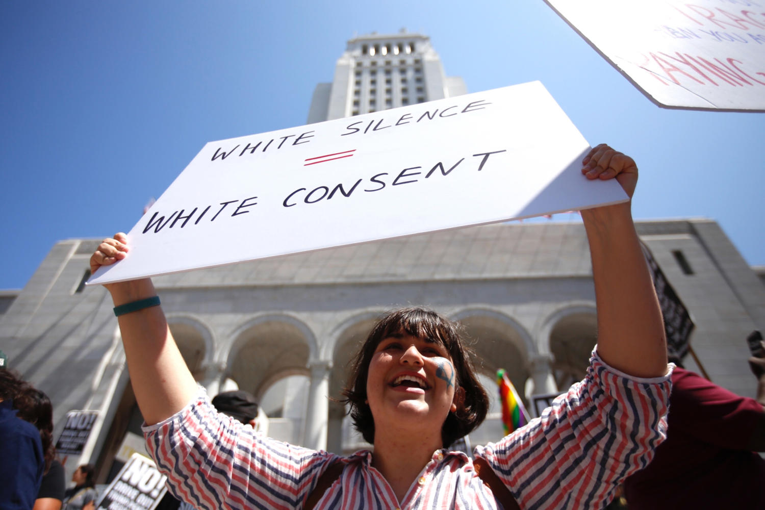 Juliette Polonsky, Pasadena in a during rally a local group calling itself Refuse Fascism rallies at City Hall in Los Angeles to denounce the violence and honor the victims in Charlottesville, Virginia August 13, 2017. (Francine Orr/ Los Angeles Times/TNS)