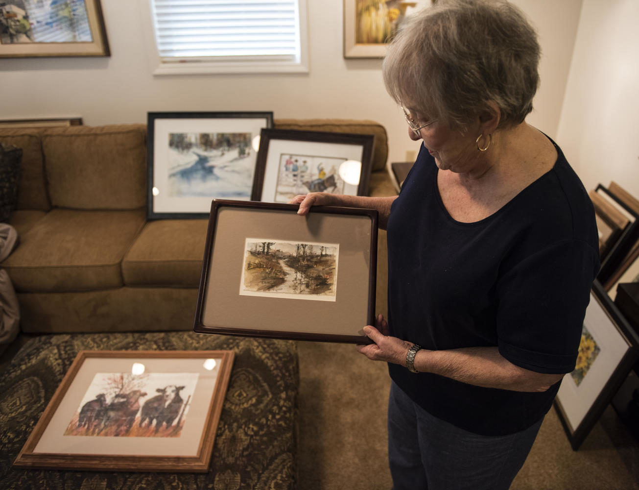 Carolyn Hollabaugh shows her painting called November Morning she did from a photo Tuesday Sept. 5, 2017, at her residence in Murphysboro. (Dylan Nelson | @DylanNelson99)