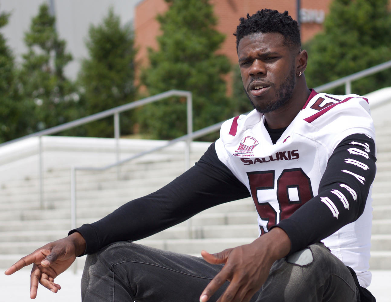 Defensive lineman Raymond Sullivan, 19, of Houston Texas, talks about the damage he saw from Hurricane Harvey Monday Sept. 11, 2017, outside SIU Arena. “On a scale from one to ten, it was an eleven,” Sullivan said. (Mary Newman | @MaryNewmanDE) 