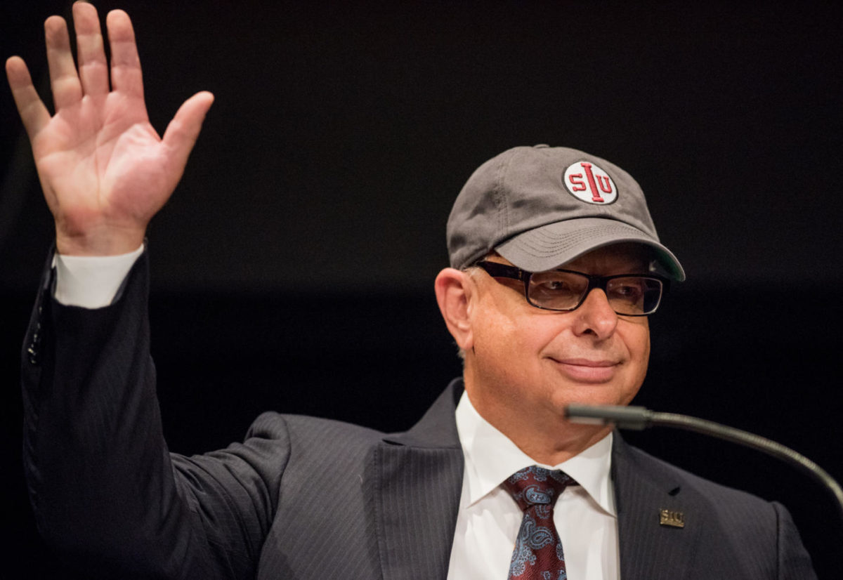Southern Illinois University Chancellor Carlo Montemagno waves to the audience after his State of the University speech Tuesday, Sept. 26, 2017, at Shryock Auditorium. Montemagno spoke on his vision for the university and the steps administration plans to take to increase enrollement numbers. (Brian Muñoz | @BrianMMunoz)