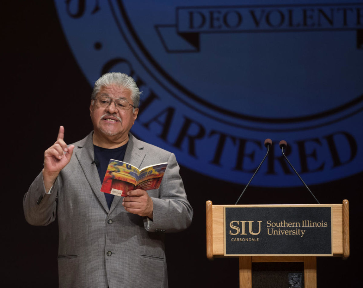 Poet lauterate Luis Rodriguez reads from his book “Borrowed Bones: New Poems from the Poet Laureate of Los Angeles” Tuesday, Sept. 26, 2017 during a presentation in part of the Nancy and Micheal Glassman lecture series in the SIU Student Center. (Dylan Nelson | @Dylan_Nelson99)