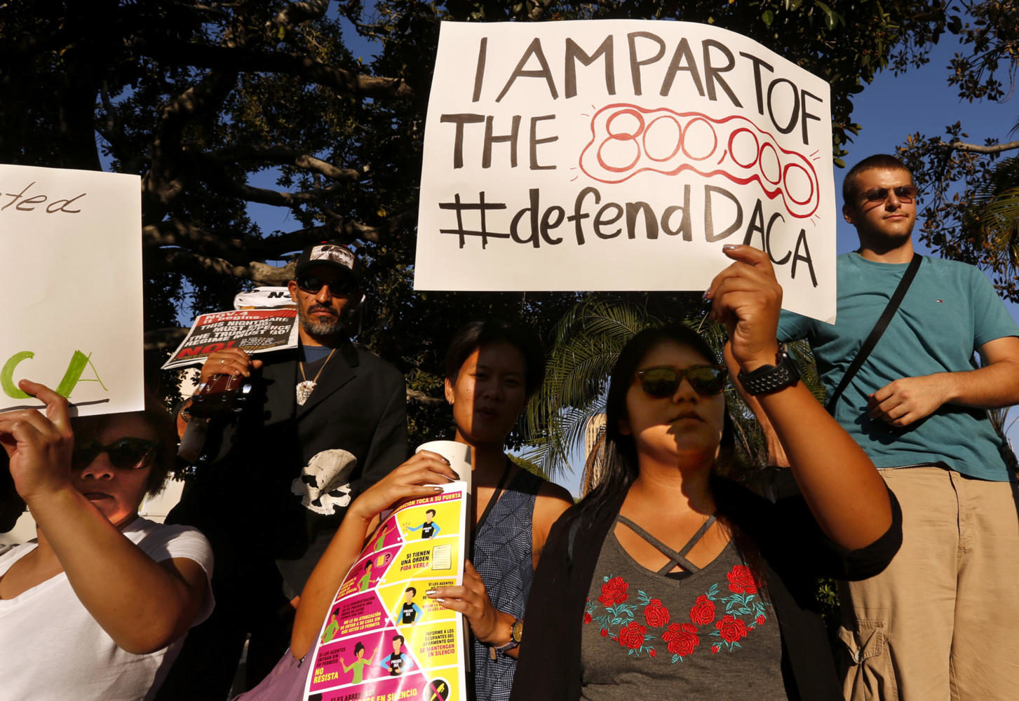 Los Angeles Harbor College student Brenda Soriano, second from right, and her mother Edilbertha Martinez, left, participate in a rally in support of the Deferred Action for Child Arrivals, or DACA program in Los Angeles on September 5, 2017. Brenda and her sister Diana Martinez are in the Deferred Action for Child Arrivals, or DACA program. The Soriano family are originally from Oaxaca, Mexico. Diana is studying to be an aerospace engineer and Brenda is studying to be a journalist. The girls came illegally to the U.S. at ages 3 and 7 in the back of a van through Tijuana. (Genaro Molina/Los Angeles Times/TNS)