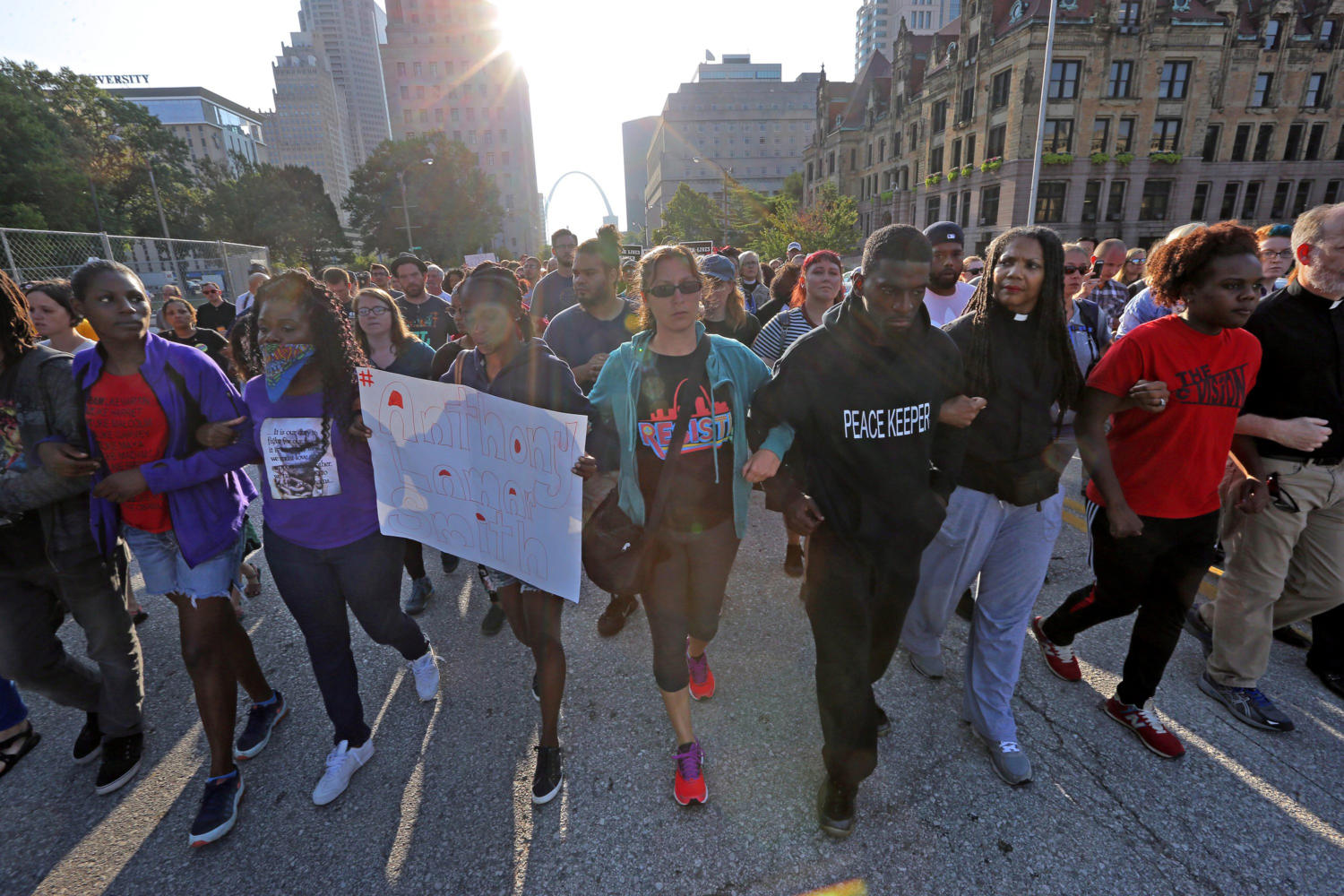 Rep. Bruce Franks Jr., D-St. Louis (third from right) leads a silent march on Market Street on Monday, Sept. 17, 2017. (Cristina M. Fletes/St. Louis Post-Dispatch/TNS)