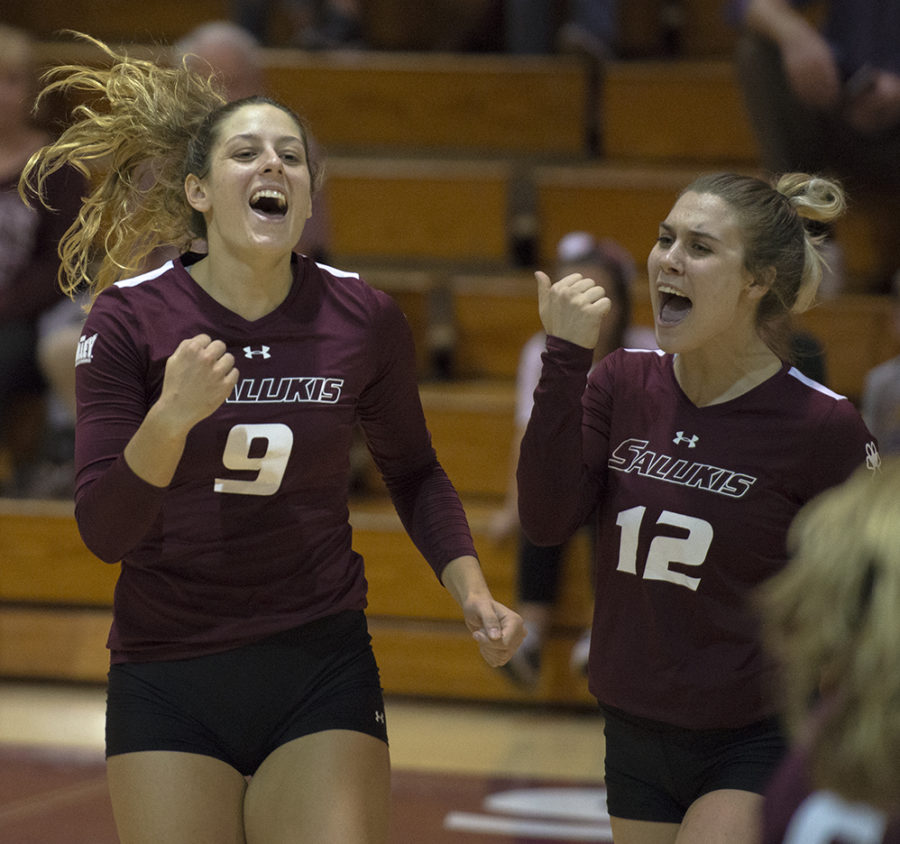 Senior outside hitter Andrea Estrada, 9, (left), and sophomore outside hitter Alysa Sutton, 12, celebrate a  point Saturday, Oct. 20, 2017, during the Salukis’ five set loss against Bradley University at Davies Gym. (Mary Newman | @MaryNewmanDE)