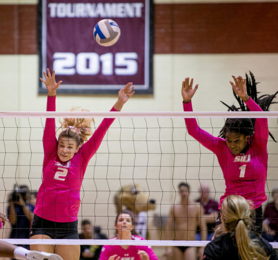 Freshman outside hitter Maggie Nedoma and senior middle hitter Kolby Meeks attempt a block Friday, Oct. 20, 2017 during the Salukis Dig for a Cure match against Bradley at Davies Gym. (Brian Munoz | @BrianMMunoz)