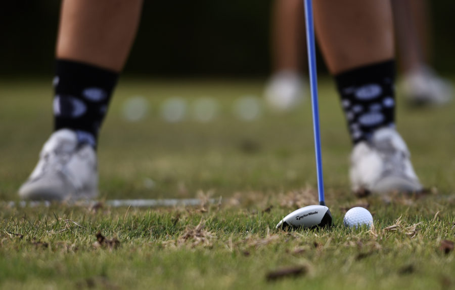 Freshman Rosemarie Bundy, of St. Charles, lines up for a pitch shot, Thursday, Oct. 5, 2017, at Hickory Ridge golf course. (Mary Newman | @MaryNewmanDE)