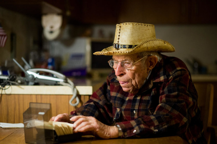 World War II veteran Calvin Maginel, of Anna, looks through a Rolodex Friday, Nov. 10, 2017, at his home in Anna. (Brian Muñoz | @BrianMMunoz)