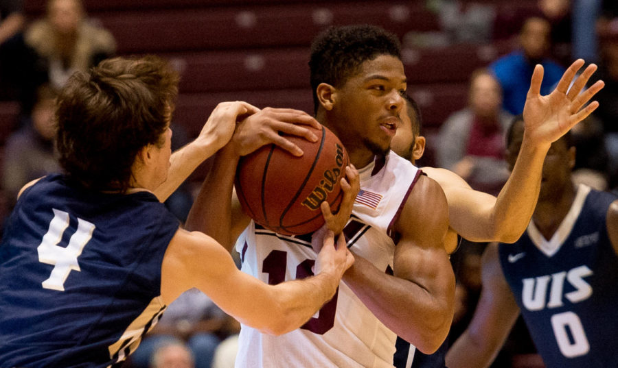 Sophomore guard Aaron Cook defends the ball Saturday, Nov. 18, 2017, during the Salukis 69-64 win against the University of Illinois Springfield Prairie Stars at SIU Arena. (Brian Muñoz | @BrianMMunoz)