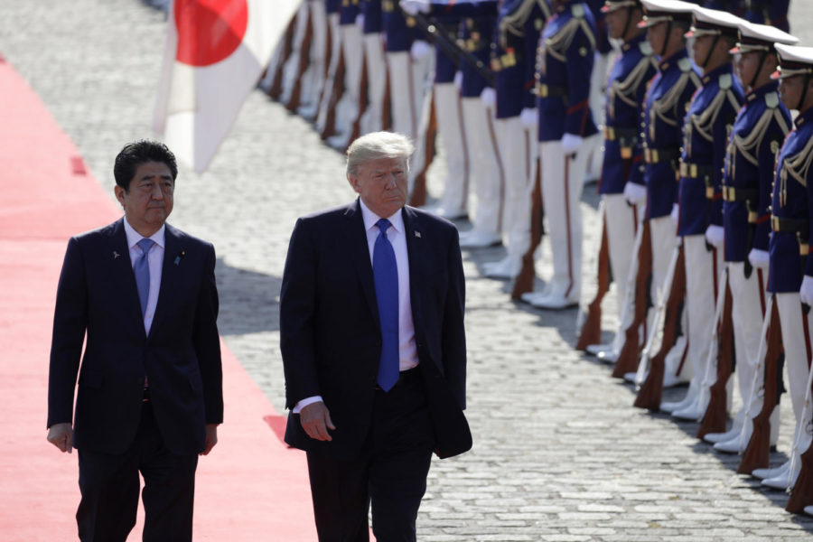 U.S. President Donald Trump, center, and Shinzo Abe, Japans prime minister, walk past an honor guard at Akasaka Palace in Tokyo, Japan, on Monday, Nov. 6, 2017. (Kiyoshi Ota/Bloomberg (Kiyoshi Ota/Xinhua/ZUMA Wire/TNS)