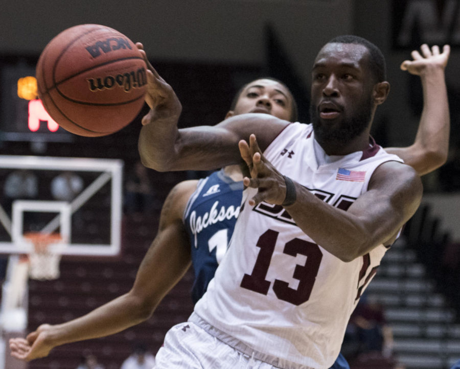 Junior guard Sean Lloyd passes the ball Wednesday, Dec. 13, during the Salukis 69-51 win against the Jackson State Tigers at SIU Arena. (Dylan Nelson | @Dylan_Nelson99)