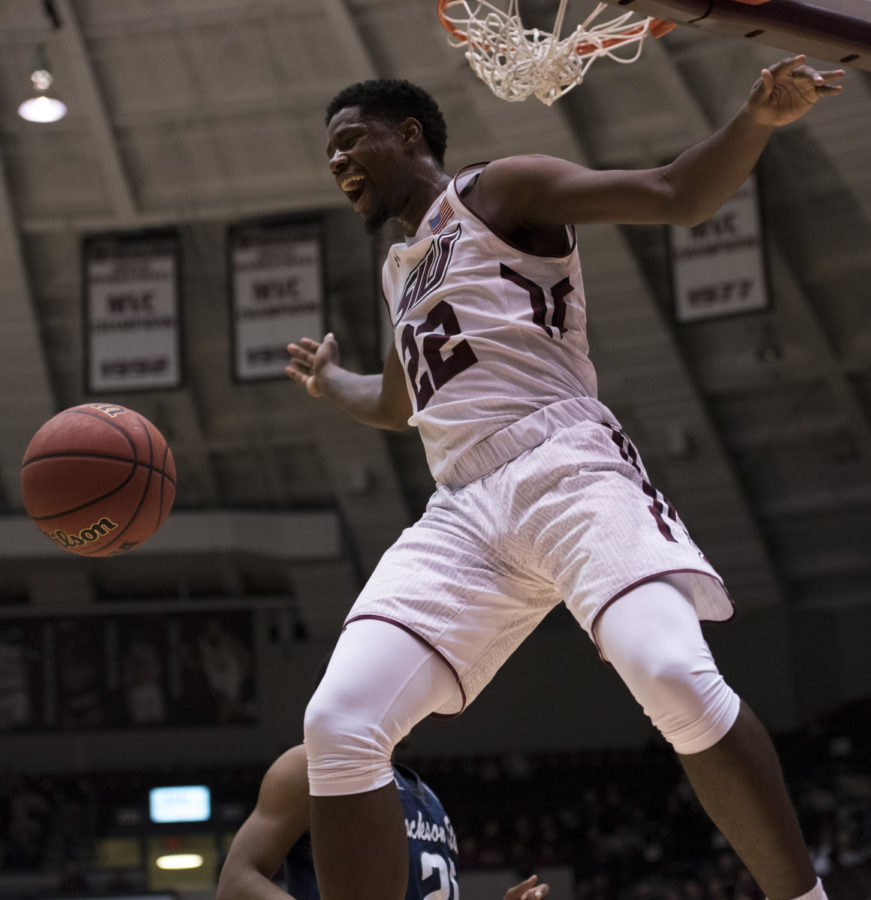 Junior guard Armon Fletcher smiles as he dunks the ball Wednesday, Dec. 13, 2017, during the Salukis 69-51 win against the Jackson State Tigers at SIU Arena. (Dylan Nelson | @Dylan_Nelson99)