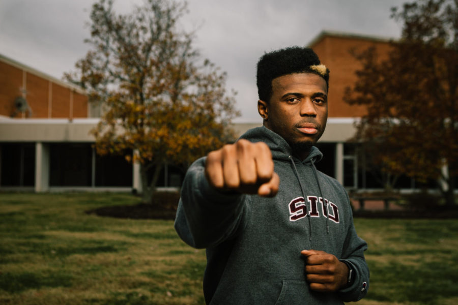 Tavae Lewis, a senior from Carbondale studying exercise science, poses for a photograph Monday, Dec. 5, 2017, outside of the Communications Building. The “Southern Illinois Golden Boy”  made his professional MMA boxing debut in the welterweight class last weekend. (Brian Muñoz | @BrianMMunoz)
