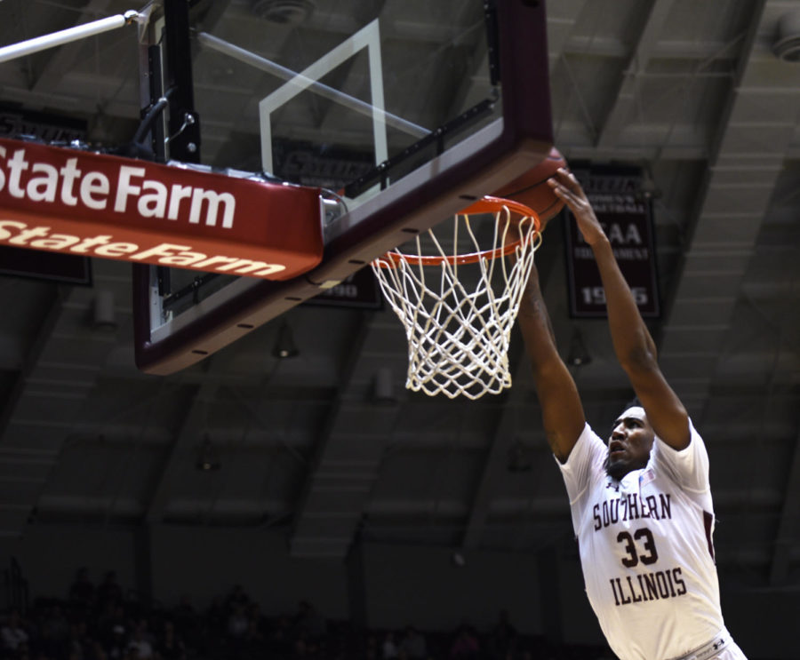 Saluki junior center Kavion Pipper dunks the ball during SIUs 82-77 win against Indiana State on Wednesday, Jan. 24, 2018, at SIU Arena. (Anna Spoerre | @AnnaSpoerre)