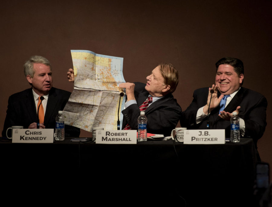 Robert Marshall, democratic candidate for the State of Illinois gubernatorial race, holds up a map Tuesday, Jan. 30, 2018, after interupting candidate Chris Kennedy at the Illinois Demoratic gubernatorial debate in the student center auditorium. 6 candidates from across Illinois are vying for the governor’s seat. (Mary Newman | @MaryNewmanDE)
