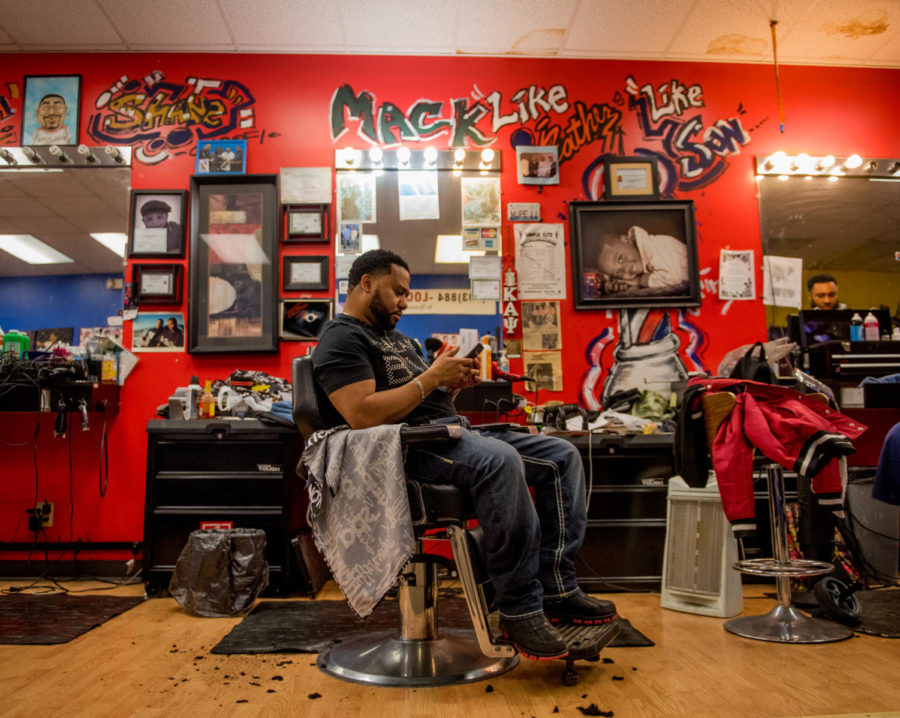 Moshe Anderson, Kampus Kuts shop owner/ waits for customers Monday, Jan. 30, 2018, at Kampus Kuts in Carbondale. I opened my shop in 2006 and the mayor showed up, Anderson said. I enjoy meetingnew and diverse people from all walks of life and different cultures. (Brian Munoz | @BrianMMunoz)