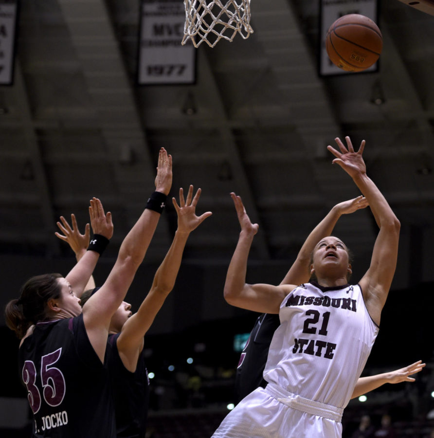 Missouri State forward Aubrey Buckley, right, jumps for the ball while under SIU pressure Friday, Jan. 26, 2018, during the Salukis 71-69 win over the Missouri State University Bears at SIU Arena. (Reagan Gavin | @RGavin_DE)