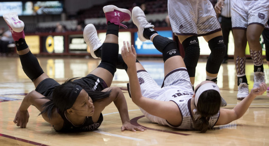 Sophomore guard Brittney Patrick and Missouri State guard Liza Fruendt fall after a play Friday, Jan. 26, 2018, during the Salukis 71-69 win over the Missouri State University Bears at SIU Arena. (Reagan Gavin | @RGavin_DE)